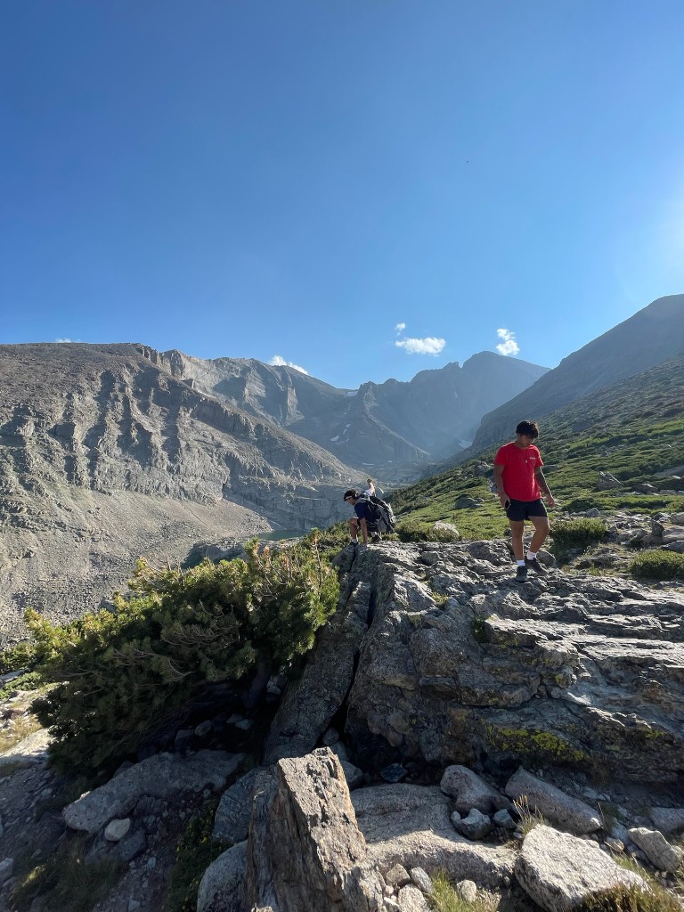 Calvin Bui hiking on a rocky mountain ridge